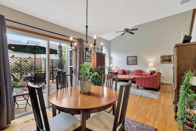 874 Dandridge Ct, Elgin, IL 60120 - dining area with vaulted ceiling, light wood finished floors, ceiling fan, and a chandelier