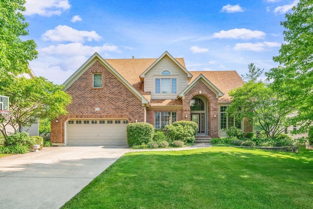 772 Wild Ginger Rd, Sugar Grove, IL 60554 - traditional-style home with brick siding, an attached garage, a front yard, driveway, and a shingled roof