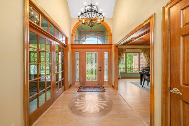 772 Wild Ginger Rd, Sugar Grove, IL 60554 - entryway featuring a chandelier, high vaulted ceiling, light wood-style floors, and french doors