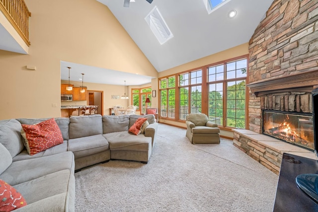 772 Wild Ginger Rd, Sugar Grove, IL 60554 - living room featuring high vaulted ceiling, a fireplace, a skylight, carpet flooring, and recessed lighting