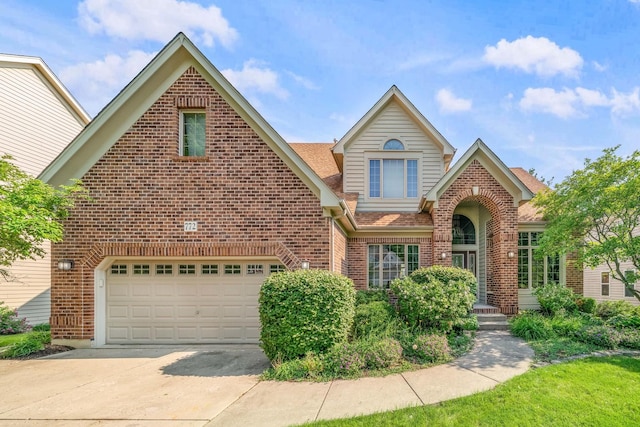 772 Wild Ginger Rd, Sugar Grove, IL 60554 - traditional home featuring brick siding, concrete driveway, roof with shingles, and an attached garage