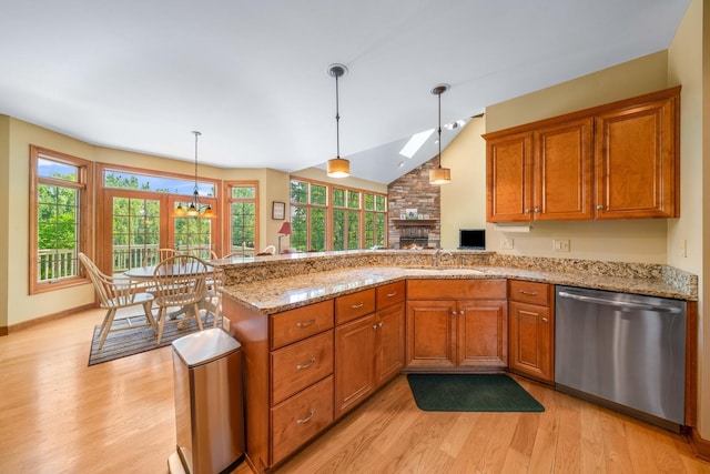 772 Wild Ginger Rd, Sugar Grove, IL 60554 - kitchen with stainless steel dishwasher, light wood-type flooring, brown cabinetry, and lofted ceiling
