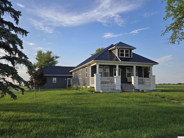 1749 N 1950th, Coatsburg, IL 62325 - view of front of home featuring a metal roof, a front lawn, and covered porch