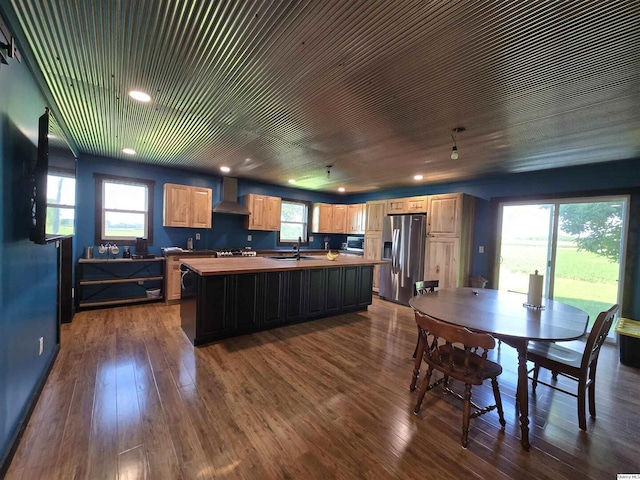 1749 N 1950th, Coatsburg, IL 62325 - kitchen with stainless steel appliances, wall chimney exhaust hood, light brown cabinetry, a center island, and dark wood-type flooring