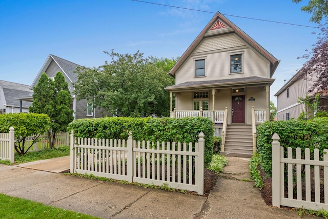 4317 N Kenneth Ave, Chicago, IL 60641 - victorian home with covered porch, a fenced front yard, and stairway