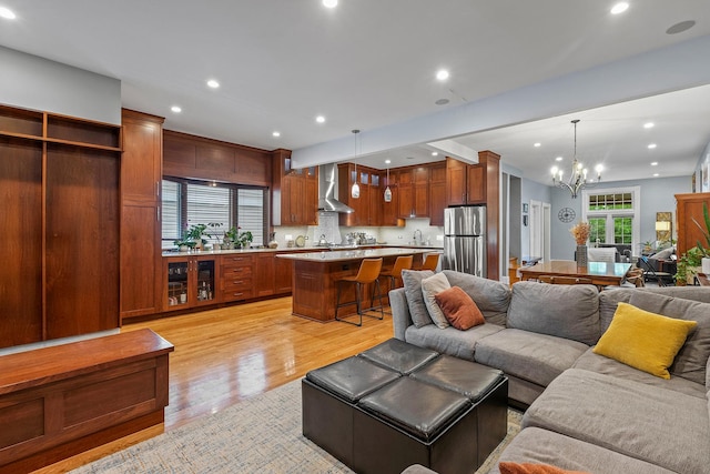 4317 N Kenneth Ave, Chicago, IL 60641 - living area featuring light wood-style floors, a chandelier, and recessed lighting