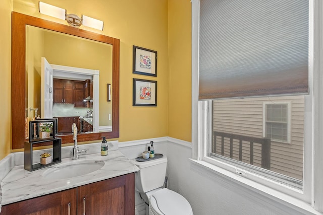 4317 N Kenneth Ave, Chicago, IL 60641 - half bath featuring vanity and a wainscoted wall