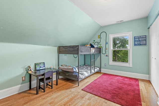 4317 N Kenneth Ave, Chicago, IL 60641 - bedroom with vaulted ceiling and wood finished floors