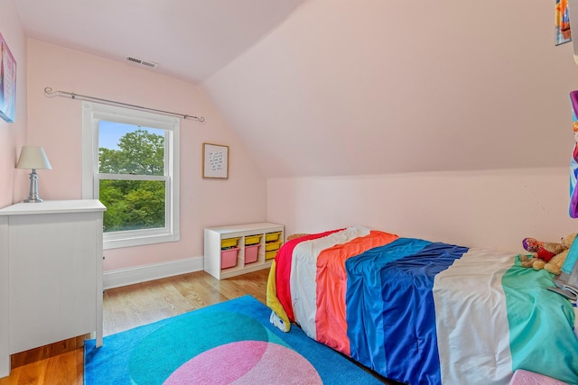 4317 N Kenneth Ave, Chicago, IL 60641 - bedroom featuring wood finished floors and lofted ceiling