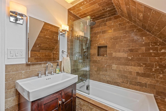 4317 N Kenneth Ave, Chicago, IL 60641 - full bath with vanity, tile walls, and tiled shower / bath combo
