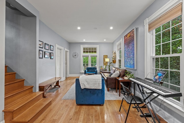 4317 N Kenneth Ave, Chicago, IL 60641 - living area with healthy amount of natural light, light wood-style flooring, stairway, and recessed lighting