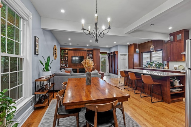 4317 N Kenneth Ave, Chicago, IL 60641 - dining area with light wood-type flooring, a chandelier, beamed ceiling, and recessed lighting