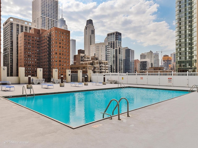 1122 N Clark St Unit 2609, Chicago, IL 60610 - community pool featuring a patio area and a skyline view
