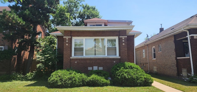 9325 S Loomis St, Chicago, IL 60620 - bungalow-style home with brick siding and a front lawn