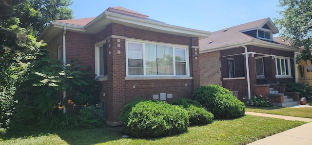 9325 S Loomis St, Chicago, IL 60620 - view of side of home featuring brick siding and a yard
