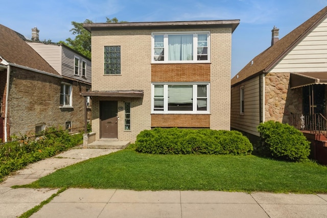 5623 S Hamilton Ave, Chicago, IL 60636 - view of front of house featuring brick siding and a front yard