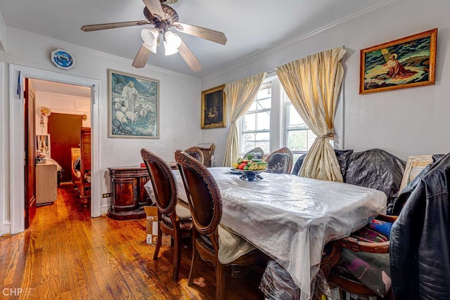 2832 N Mozart St, Chicago, IL 60618 - dining space featuring light wood-type flooring, ornamental molding, and a ceiling fan
