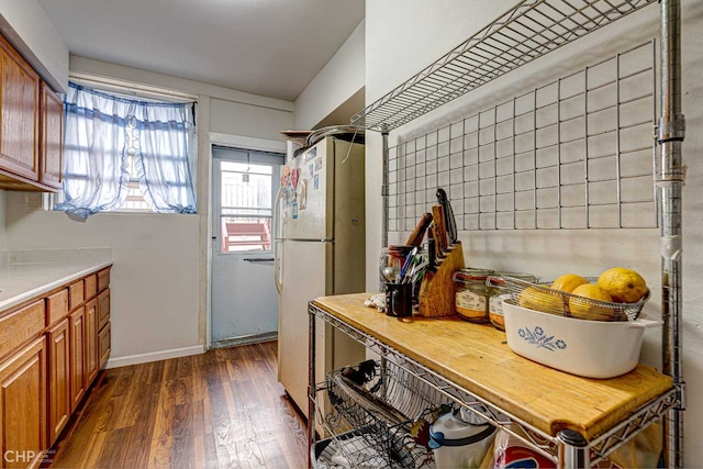 2832 N Mozart St, Chicago, IL 60618 - kitchen with freestanding refrigerator, dark wood finished floors, brown cabinets, and wood counters