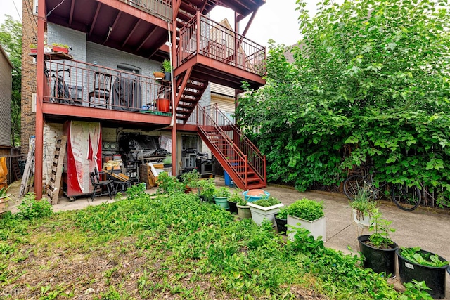 2832 N Mozart St, Chicago, IL 60618 - back of property featuring stairway, brick siding, and stone siding