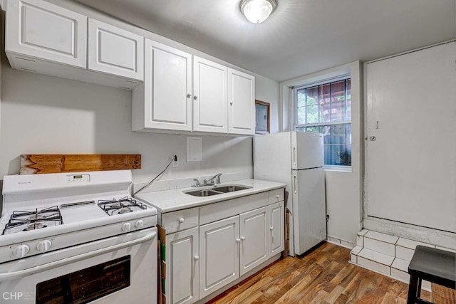2832 N Mozart St, Chicago, IL 60618 - kitchen featuring white appliances, light wood-style floors, white cabinetry, and light countertops