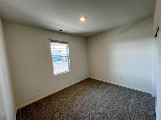 1075 Savannah Ln, Pingree Grove, IL 60140 - unfurnished room with dark colored carpet and baseboards