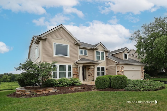 1312 Mulberry Ln, Cary, IL 60013 - view of front of property featuring stone siding, a front lawn, and a garage