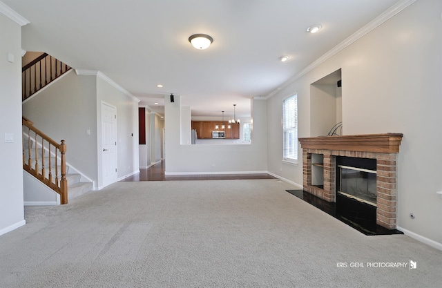 1312 Mulberry Ln, Cary, IL 60013 - unfurnished living room featuring crown molding, stairway, carpet floors, a brick fireplace, and recessed lighting
