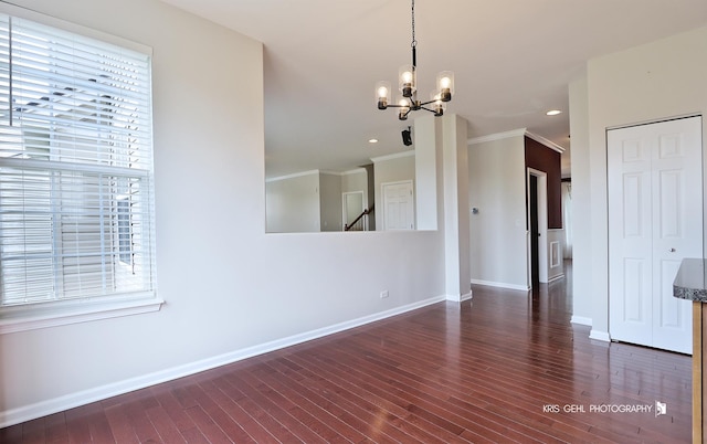 1312 Mulberry Ln, Cary, IL 60013 - spare room featuring ornamental molding, a chandelier, wood finished floors, and recessed lighting