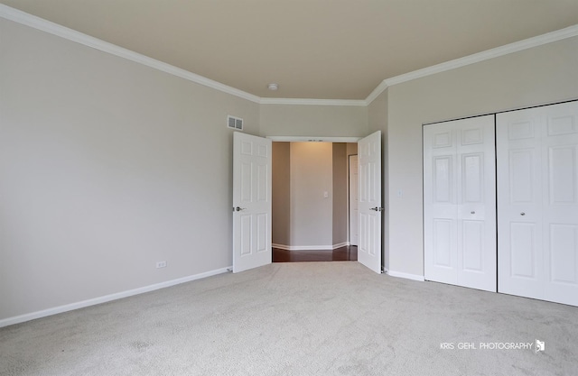 1312 Mulberry Ln, Cary, IL 60013 - unfurnished bedroom with ornamental molding, carpet floors, and a closet