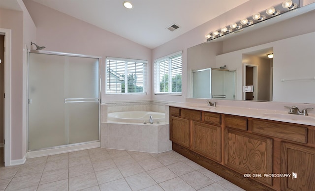 1312 Mulberry Ln, Cary, IL 60013 - full bathroom featuring a stall shower, a garden tub, double vanity, lofted ceiling, and tile patterned flooring