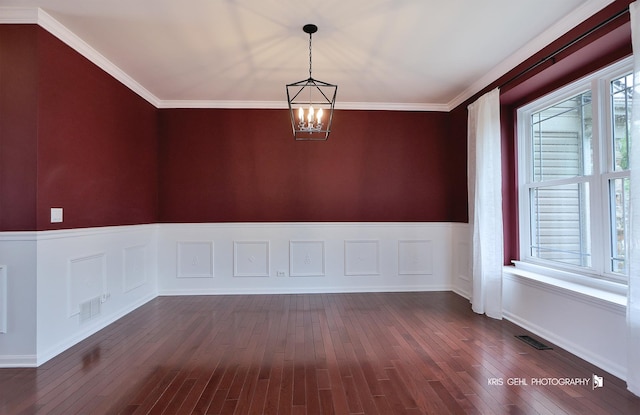 1312 Mulberry Ln, Cary, IL 60013 - empty room featuring a chandelier, dark wood finished floors, wainscoting, and crown molding