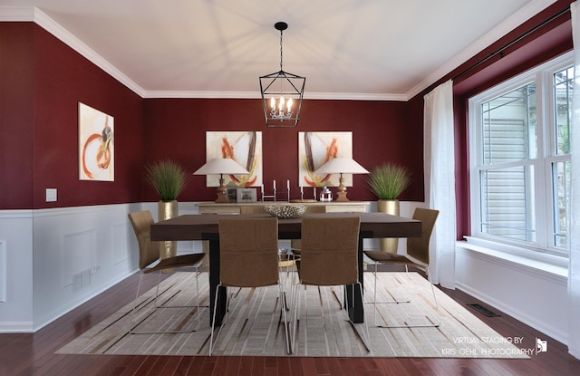 1312 Mulberry Ln, Cary, IL 60013 - dining area featuring a chandelier, healthy amount of natural light, wood-type flooring, a wainscoted wall, and crown molding