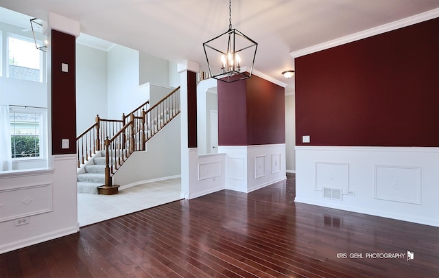 1312 Mulberry Ln, Cary, IL 60013 - entryway featuring hardwood / wood-style floors, wainscoting, a chandelier, stairs, and ornamental molding