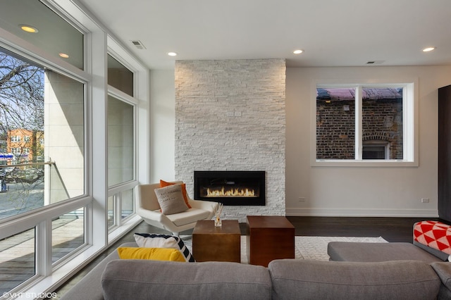 1522 W Huron St Unit 2W, Chicago, IL 60642 - living area featuring a fireplace, wood finished floors, and recessed lighting