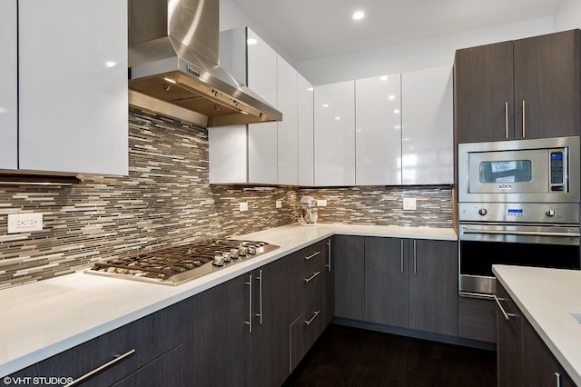 1522 W Huron St Unit 2W, Chicago, IL 60642 - kitchen with range hood, stainless steel appliances, modern cabinets, and light countertops