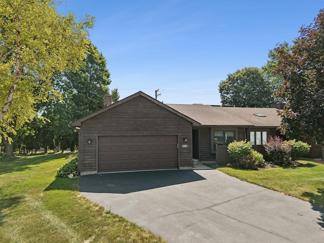 225 Mattek Ct, Dekalb, IL 60115 - single story home featuring a chimney, asphalt driveway, a front yard, and an attached garage