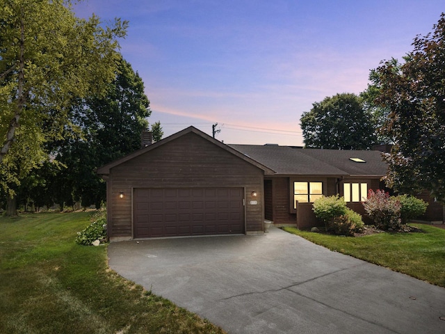 225 Mattek Ct, Dekalb, IL 60115 - ranch-style house featuring driveway, a yard, a garage, and a chimney