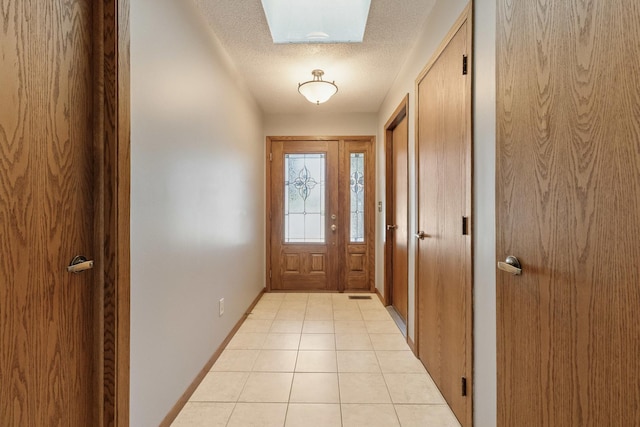 225 Mattek Ct, Dekalb, IL 60115 - doorway featuring a textured ceiling and light tile patterned flooring
