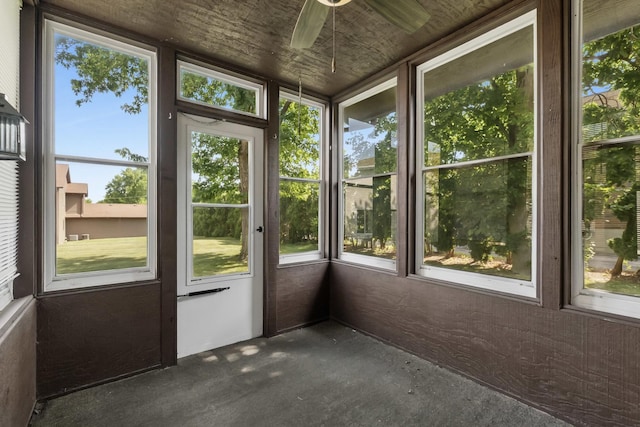 225 Mattek Ct, Dekalb, IL 60115 - unfurnished sunroom featuring ceiling fan and plenty of natural light