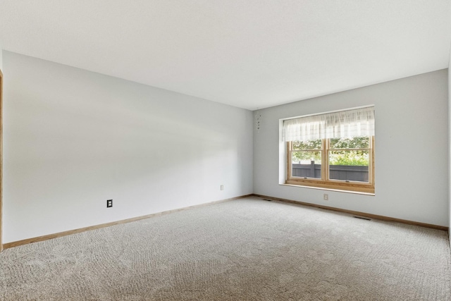 225 Mattek Ct, Dekalb, IL 60115 - empty room with light carpet and baseboards