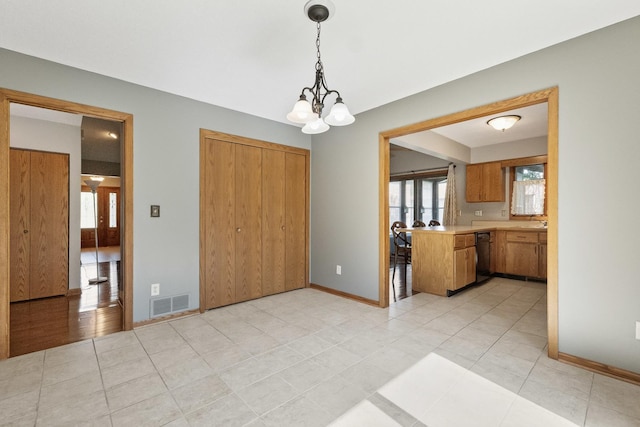 225 Mattek Ct, Dekalb, IL 60115 - unfurnished dining area featuring healthy amount of natural light, a chandelier, and light tile patterned floors
