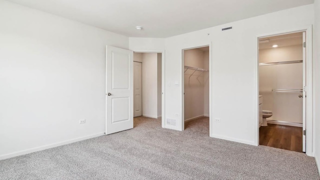 17317 Ulster Dr, Tinley Park, IL 60477 - unfurnished bedroom with carpet, a spacious closet, a closet, and ensuite bathroom