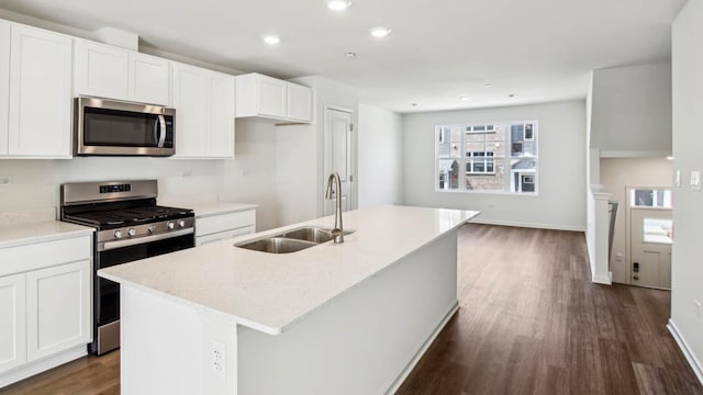 17317 Ulster Dr, Tinley Park, IL 60477 - kitchen with appliances with stainless steel finishes, dark wood-type flooring, a center island with sink, recessed lighting, and white cabinets