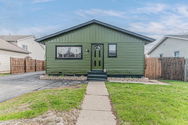 2105 Prospect Ave, North Chicago, IL 60064 - view of front facade with entry steps and board and batten siding