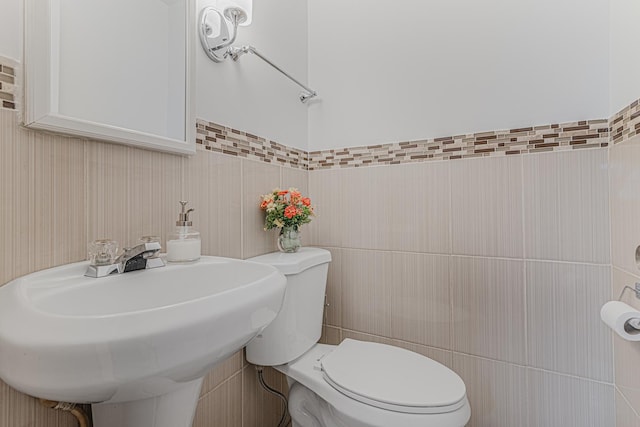 2105 Prospect Ave, North Chicago, IL 60064 - half bathroom with tile walls and toilet
