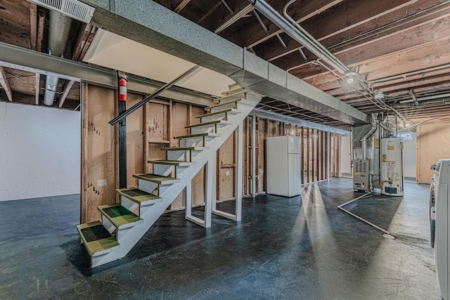 2105 Prospect Ave, North Chicago, IL 60064 - unfinished below grade area with freestanding refrigerator, water heater, and stairway