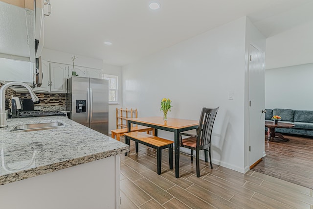 2105 Prospect Ave, North Chicago, IL 60064 - dining space with light wood-type flooring and recessed lighting