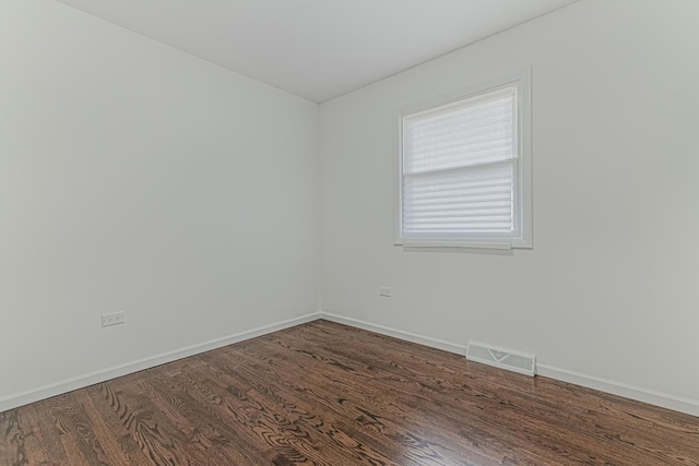 2105 Prospect Ave, North Chicago, IL 60064 - spare room with dark wood finished floors and baseboards