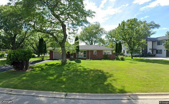 1430 Evergreen Ter, Glenview, IL 60025 - view of front of house featuring an attached garage, a front lawn, brick siding, and driveway