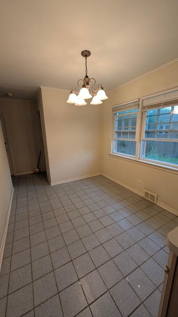 1430 Evergreen Ter, Glenview, IL 60025 - empty room featuring a chandelier and crown molding